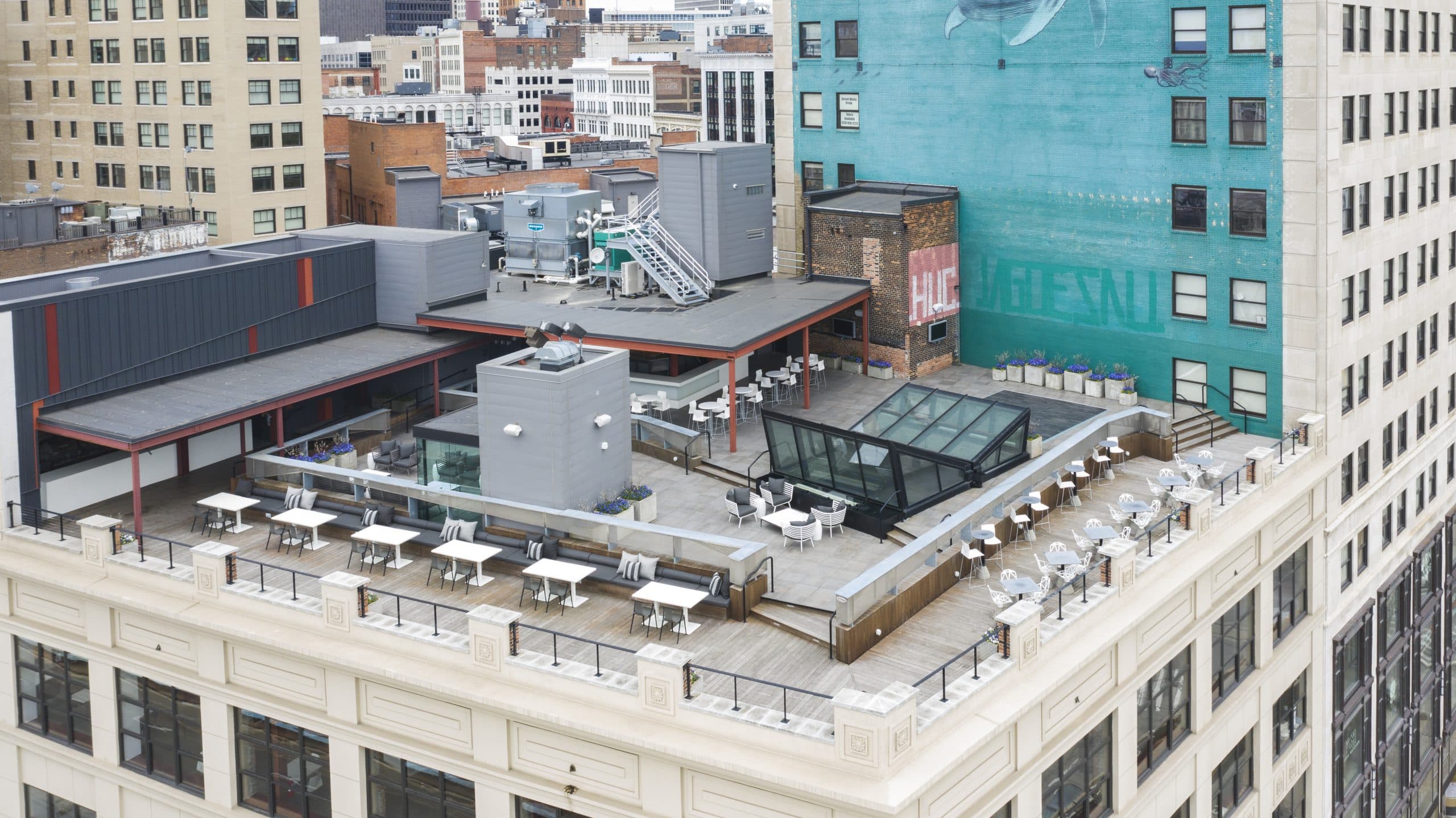 Birdseye view of The Madison Rooftop set with tables, chairs, and dance floor.